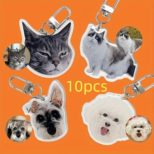 Set of 10 cat and dog keychains on an orange background