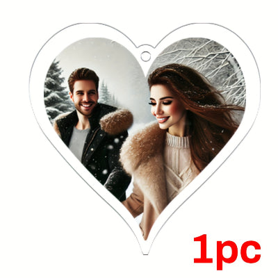 Heart-shaped photo frame with a couple in winter clothing on a white background