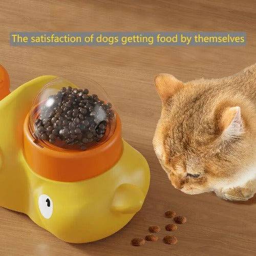 Cat interacting with a yellow and orange pet toy on a wooden surface
