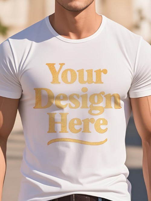 White t-shirt with 'Your Design Here' text in gold on a blurred outdoor background
