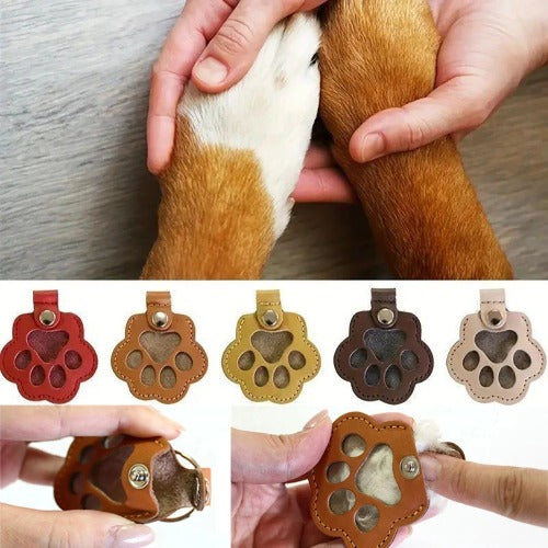Personalized leather pet memorial keychain with engraved paw charm and hair keepsake pouch
