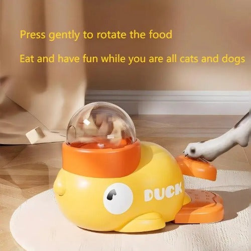 Yellow duck-shaped pet toy with descriptive text on a wooden floor

